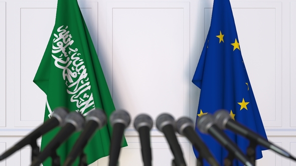 Flags of Saudi Arabia and the European Union at International Press Conference alt