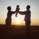 Young Family Walking along with Young Child at Sunset - VideoHive Item for Sale