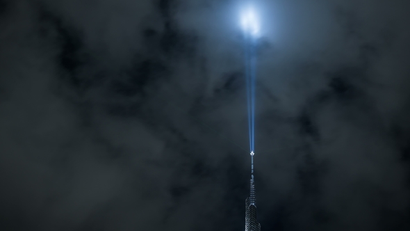 The Bright Spotlight on the Spire of Burj Khalifa Shines in the Sky. Dubai, UAE