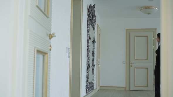 Glamorous Girl Looks at Mirror and Goes Away in Home