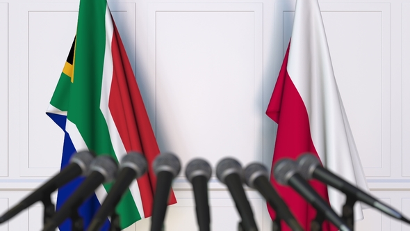 Flags of South Africa and Poland at International Press Conference alt
