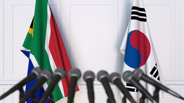 Flags of South Africa and Korea at International Press Conference alt