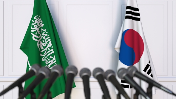 Flags of Saudi Arabia and Korea at International Press Conference alt