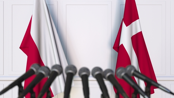 Flags of Poland and Denmark at International Press Conference alt