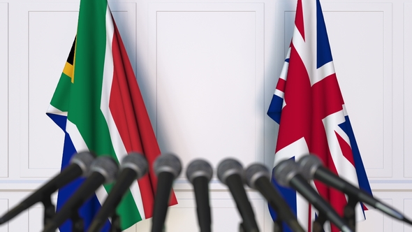 Flags of South Africa and The United Kingdom at International Press Conference alt