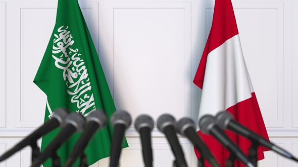 Flags of Saudi Arabia and Peru at International Press Conference alt