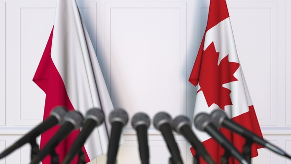 Flags of Poland and Canada at International Press Conference alt