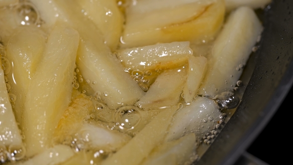 Potatoes Sliced Fried in a Pan