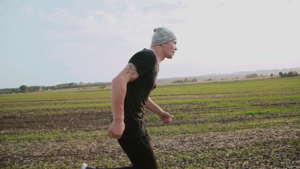 Jogger Running in the Fields on Beautiful Nature