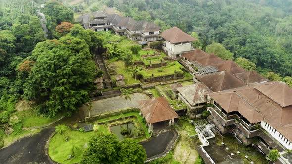 Aerial view Creepy slow motion footage of the abandoned Ghost Palace Hotel in Bali