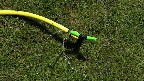 Garden irrigation system watering grass lawn