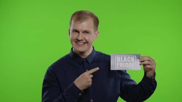 Joyful Man Showing Black Friday Inscription Note, Smiling Looking Satisfied with Low Prices