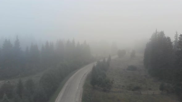 Foggy Morning in a Village Aerial View