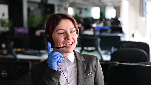 Portrait of a Friendly Female Call Center Operator