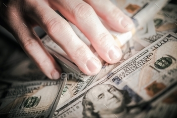 Male Hands Grabbing American One Hundred Dollar Banknotes.