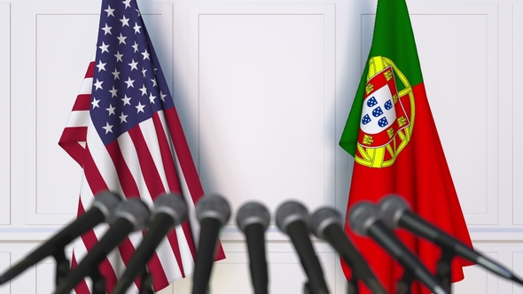 Flags of the USA and Portugal at International Press Conference alt
