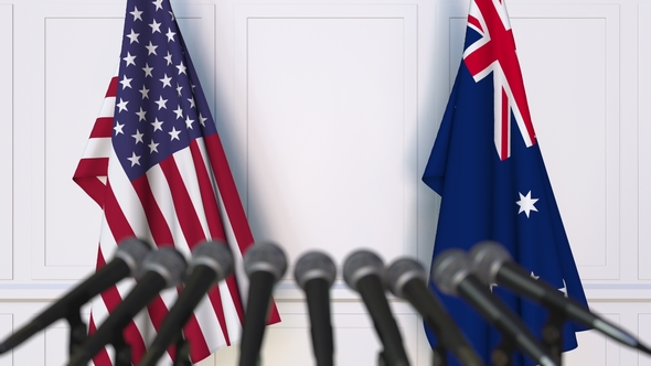 Flags of the USA and Australia at International Press Conference alt