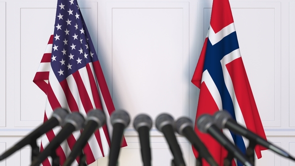 Flags of the USA and Norway at International Press Conference alt