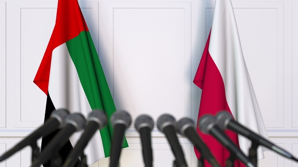 Flags of the UAE and Poland at International Press Conference alt