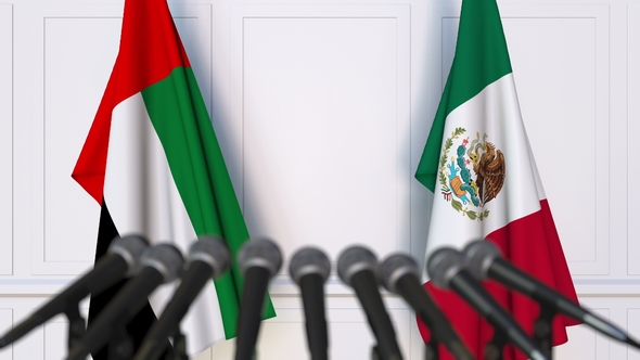 Flags of the UAE and Mexico at International Press Conference alt