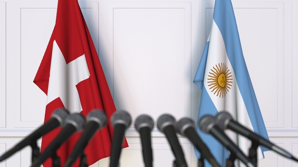 Flags of Switzerland and Argentina at International Press Conference alt