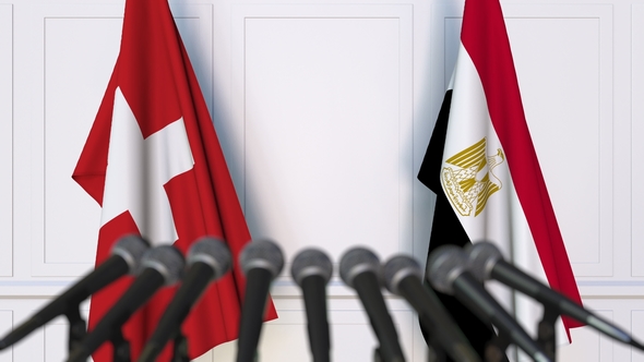 Flags of Switzerland and Egypt at International Press Conference alt