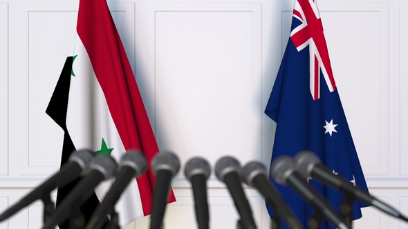 Flags of Syria and Australia at International Press Conference alt