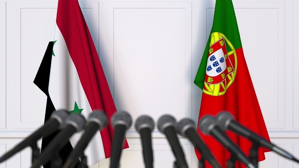 Flags of Syria and Portugal at International Press Conference alt