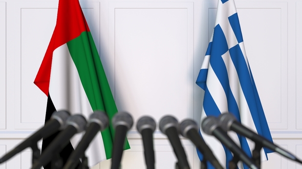 Flags of the UAE and Greece at International Press Conference alt