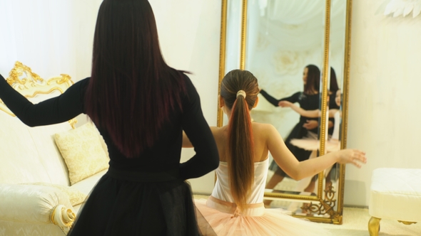 Mom Ballerina and Daughter Ballerina Doing Dance Moves