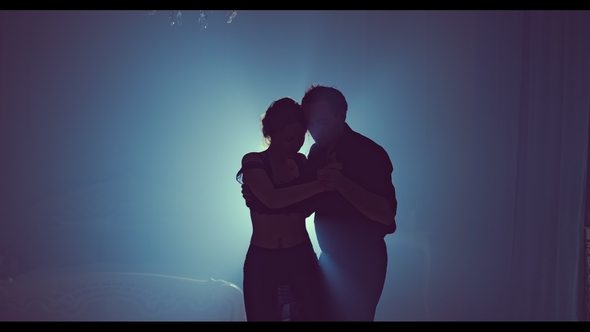 Professional Dancers Dancing in Ballroom Silhouette