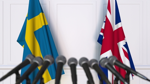 Flags of Sweden and The United Kingdom at International Press Conference alt