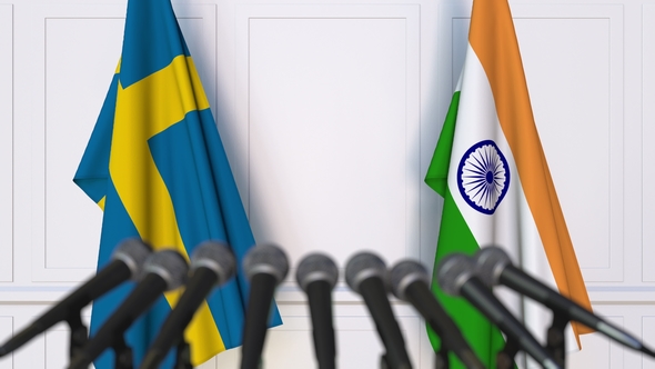 Flags of Sweden and India at International Press Conference alt