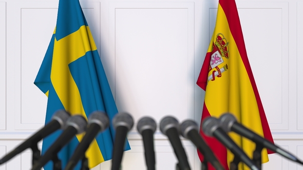 Flags of Sweden and Spain at International Press Conference alt
