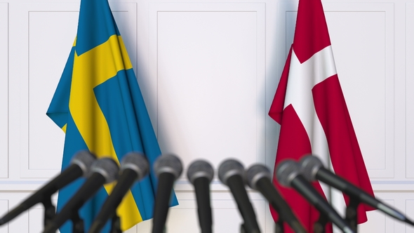 Flags of Sweden and Denmark at International Press Conference alt