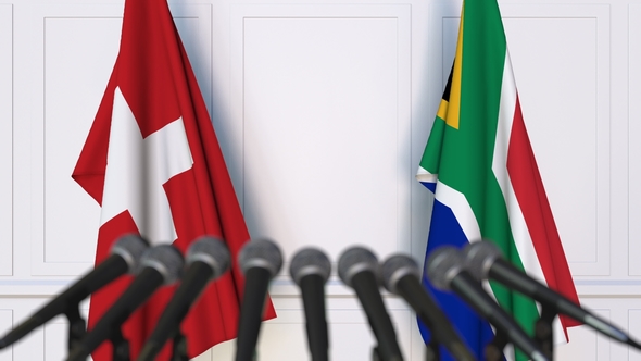 Flags of Switzerland and South Africa at International Press Conference alt