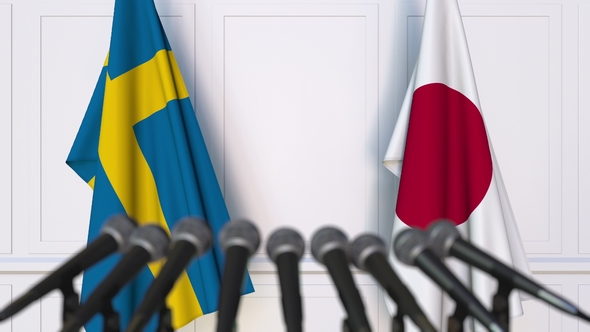 Flags of Sweden and Japan at International Press Conference alt