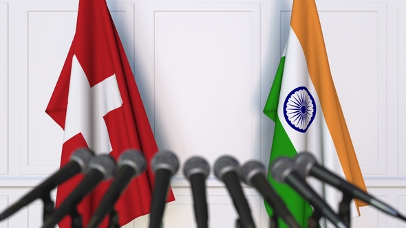 Flags of Switzerland and India at International Press Conference alt