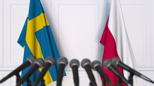 Flags of Sweden and Poland at International Press Conference alt