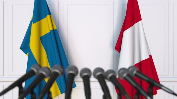 Flags of Sweden and Peru at International Press Conference alt