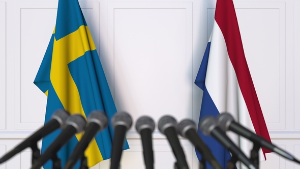 Flags of Sweden and Netherlands at International Press Conference alt