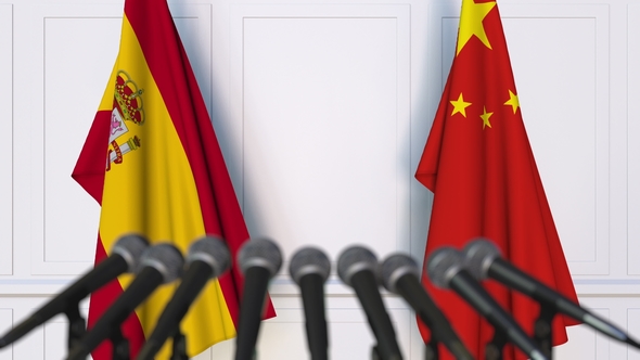 Flags of Spain and China at International Press Conference alt