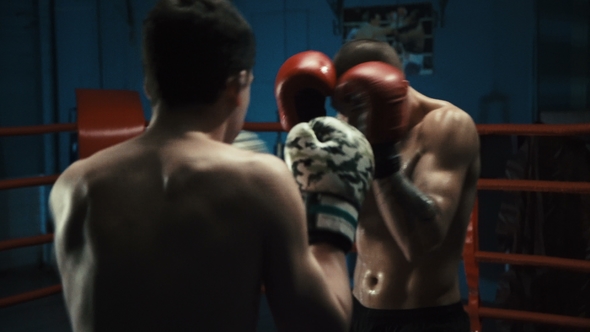 Men Practicing Box on Ring