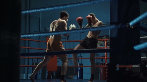 Men Practicing Box on Ring