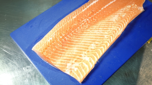 Chef Cutting Fresh Salmon