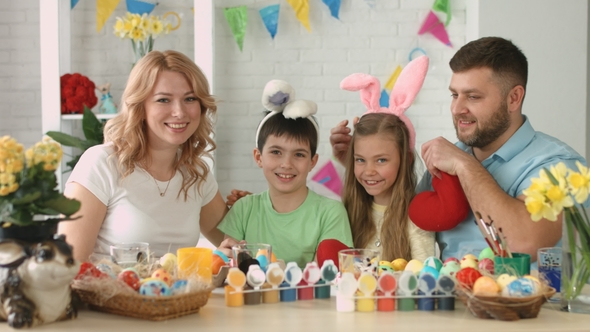 Portrait of Happy Friendly Family with Two Children During Easter Celebration