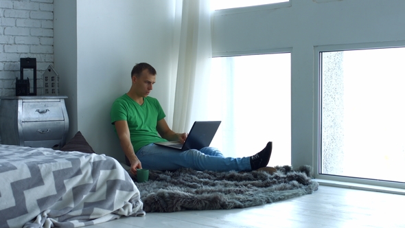 Handsome Male Freelancer Working Home Using Laptop