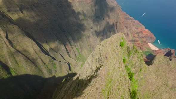 Aerial Shot of Helicopter with Tourists Flying in Scenic Green Canyon on Napali