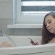 Pretty Young Woman Wathing in Cellphone in Bathroom - VideoHive Item for Sale