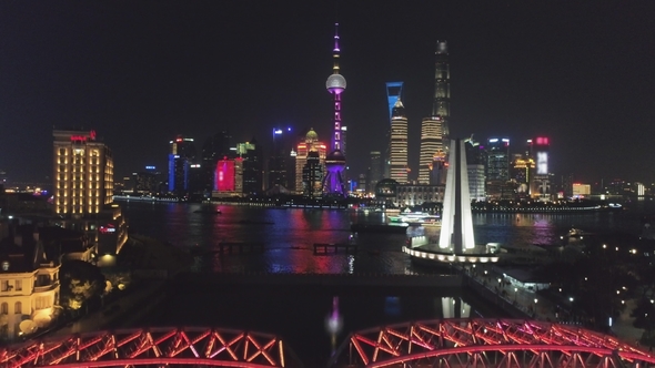 Illuminated Shanghai Downtown at Night. Lujiazui District and Huangpu River. China. Aerial View